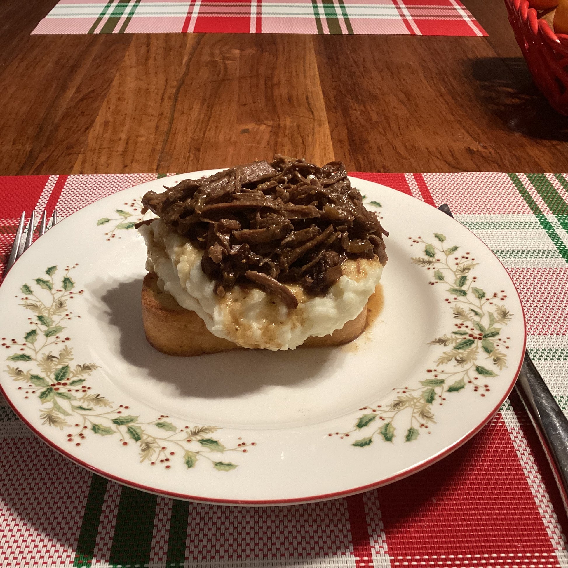 grass fed Arm Roast on a bed of mashed potatoes 