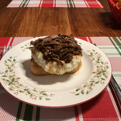 grass fed Arm Roast on a bed of mashed potatoes 